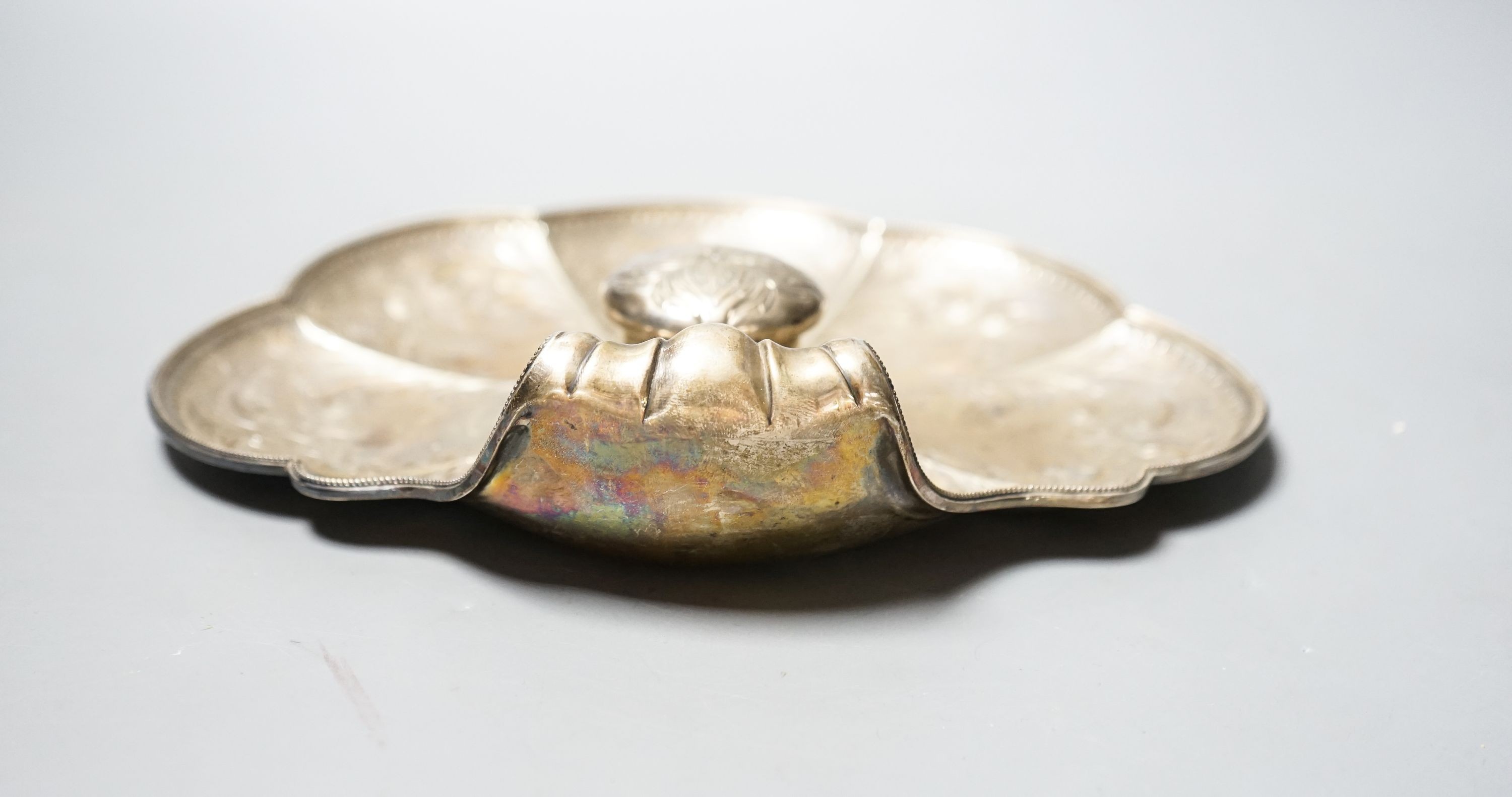 A late Victorian engraved silver shell shaped inkstand with single well, by Walker & Hall, Sheffield, 1897, 23.8cm, gross 14.5oz.